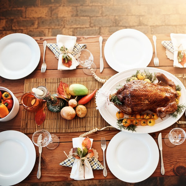 High angle shot of a dining table all laid out for Thanksgiving